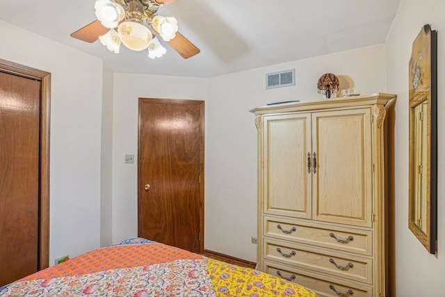 bedroom featuring ceiling fan and visible vents