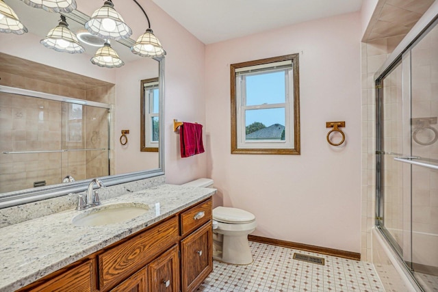 bathroom with baseboards, visible vents, vanity, and toilet