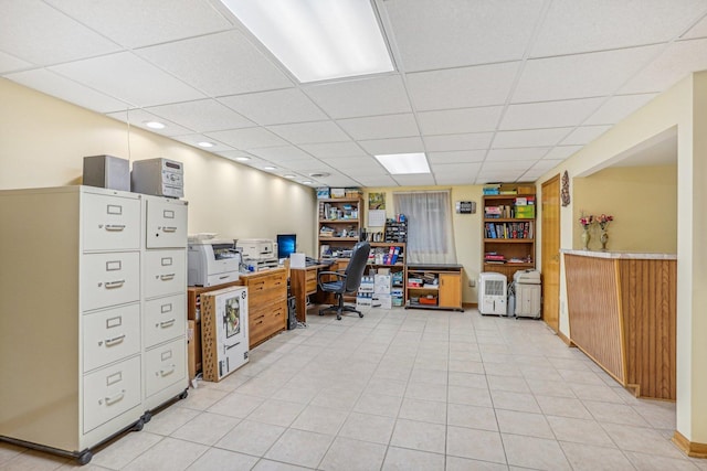 home office with a paneled ceiling