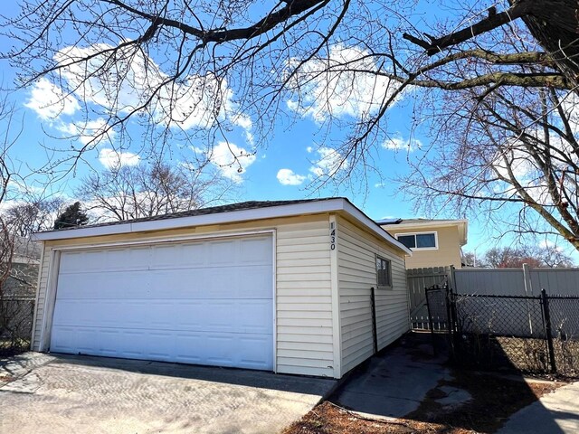 14301 Dorchester Ave, Dolton, IL 60419 - view of property exterior featuring an outbuilding, fence, and a garage