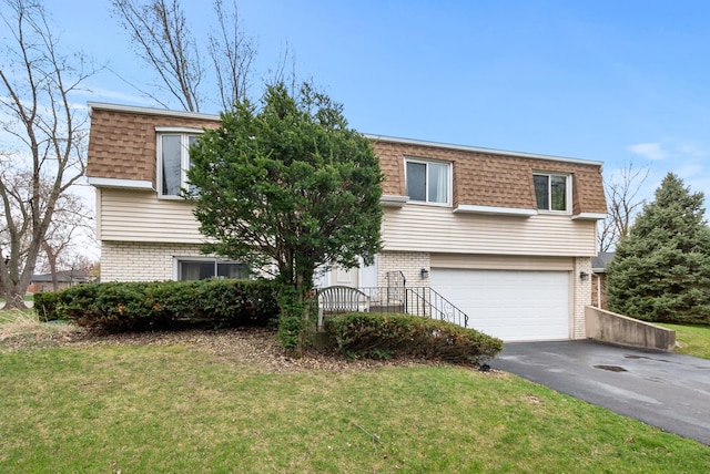 8509 Hemlock St, Orland Park, IL 60462 - view of front of property with mansard roof, brick siding, an attached garage, a shingled roof, and driveway