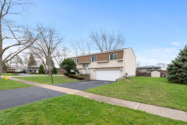 8509 Hemlock St, Orland Park, IL 60462 - raised ranch with a garage, a front yard, driveway, and brick siding