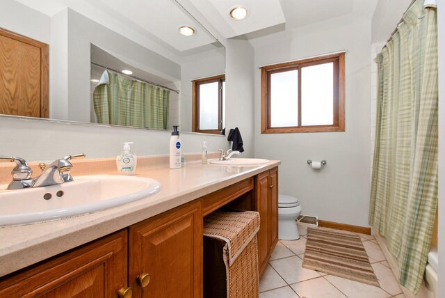 8509 Hemlock St, Orland Park, IL 60462 - bathroom with tile patterned floors, curtained shower, a sink, and toilet