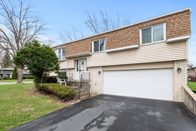 8509 Hemlock St, Orland Park, IL 60462 - bi-level home with driveway, a shingled roof, mansard roof, and a garage