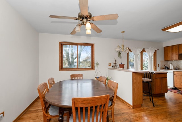 8509 Hemlock St, Orland Park, IL 60462 - dining area featuring light wood-style flooring, baseboards, and ceiling fan