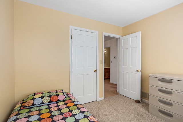 unfurnished bedroom with baseboards and light carpet