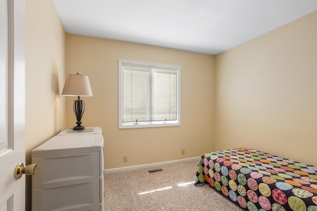 bedroom with carpet floors, baseboards, and visible vents