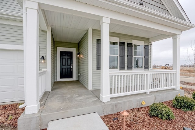 doorway to property featuring covered porch