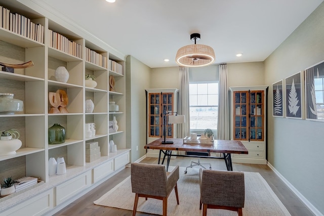 home office with recessed lighting, light wood-style flooring, and baseboards
