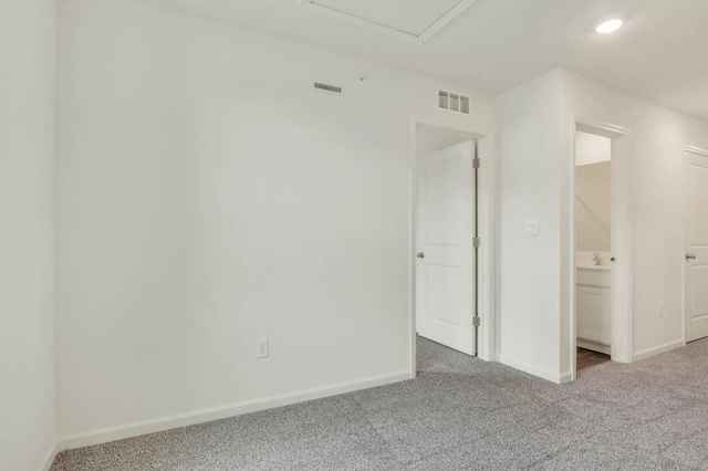 unfurnished room featuring recessed lighting, carpet, visible vents, and baseboards