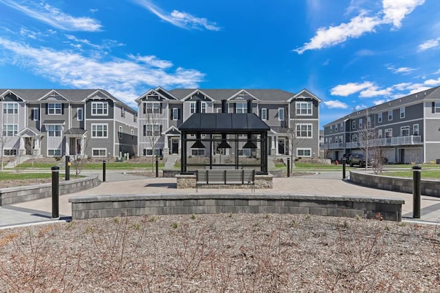 surrounding community with a gazebo and a residential view