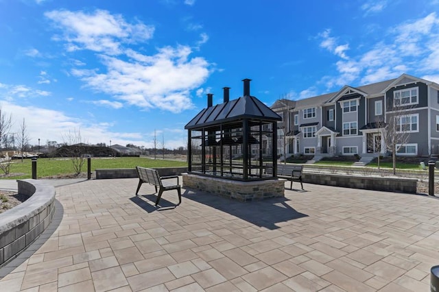 view of property's community with a gazebo and a patio area