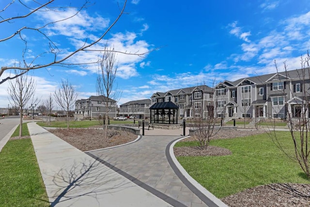 view of home's community featuring a yard, a gazebo, and a residential view