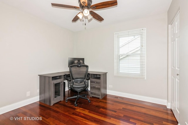 home office with wood finished floors, ceiling fan, and baseboards