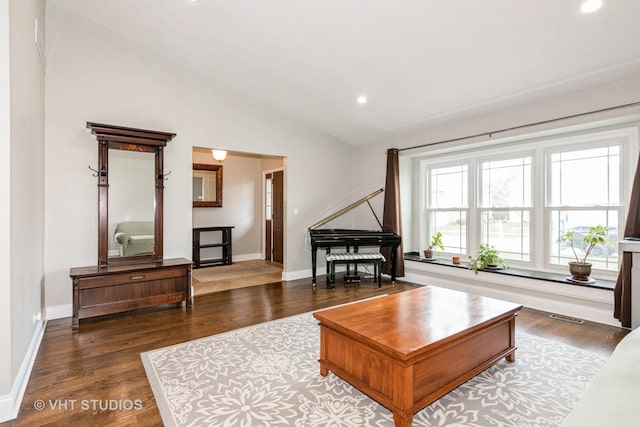 living room featuring visible vents, baseboards, recessed lighting, wood finished floors, and lofted ceiling