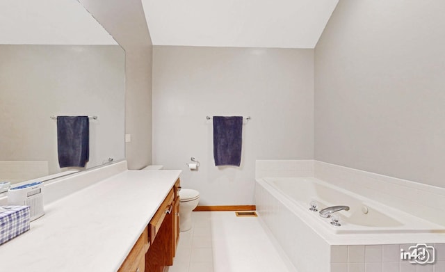 bathroom featuring a garden tub, toilet, vanity, and baseboards