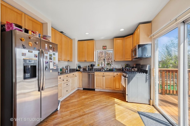 4041 N Kilbourn Ave Unit 2N, Chicago, IL 60641 - kitchen featuring appliances with stainless steel finishes, a sink, light wood finished floors, light brown cabinets, and recessed lighting
