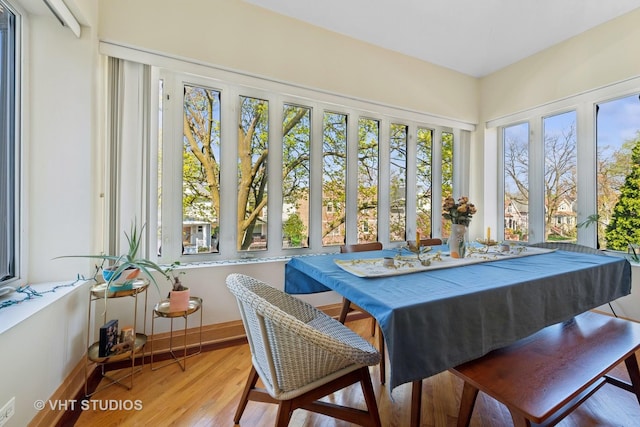 4041 N Kilbourn Ave Unit 2N, Chicago, IL 60641 - sunroom / solarium featuring baseboards and wood finished floors