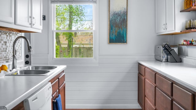laundry area featuring a sink and cabinet space