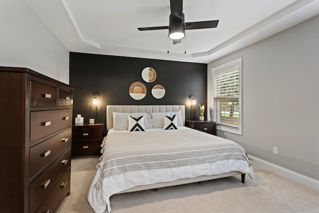 1318 Ridge Pointe Dr, Monticello, IL 61856 - bedroom with light carpet, baseboards, a raised ceiling, and ceiling fan