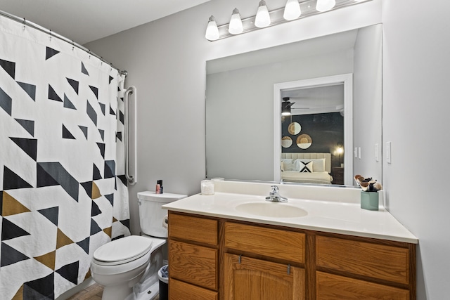 1318 Ridge Pointe Dr, Monticello, IL 61856 - ensuite bathroom with vanity, toilet, wood finished floors, ceiling fan, and ensuite bath