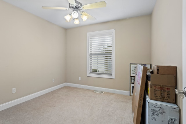 1318 Ridge Pointe Dr, Monticello, IL 61856 - carpeted empty room featuring visible vents, a ceiling fan, and baseboards