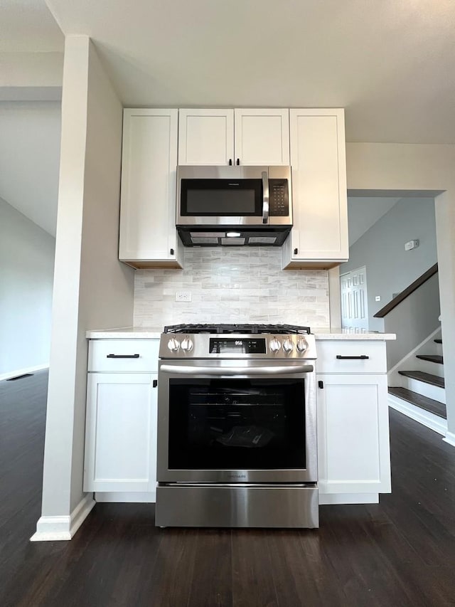 kitchen with light countertops, white cabinets, and stainless steel appliances