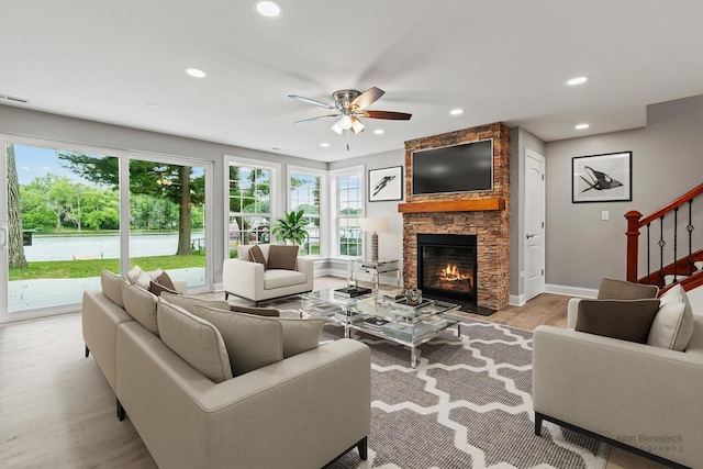 2015 N Woodlawn Park Ave, Mchenry, IL 60051 - living area with light wood-style floors, a fireplace, a ceiling fan, and recessed lighting