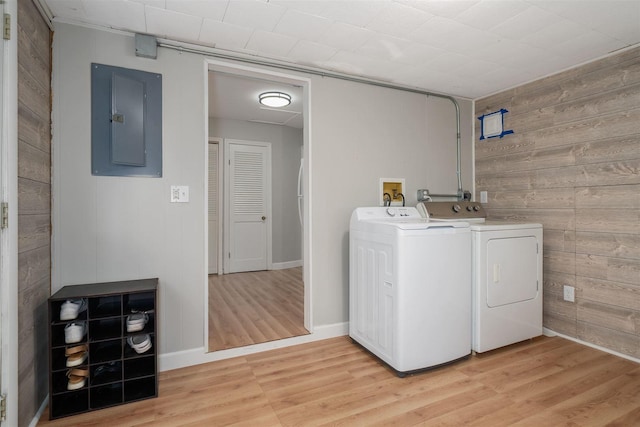 212 Keiser Ave, Normal, IL 61761 - washroom featuring electric panel, separate washer and dryer, wooden walls, and light wood-style flooring
