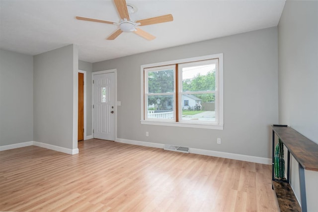 212 Keiser Ave, Normal, IL 61761 - unfurnished living room with light wood-style flooring and ceiling fan