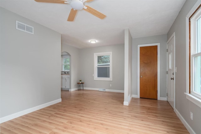 212 Keiser Ave, Normal, IL 61761 - foyer entrance featuring light wood-style floors, ceiling fan, and arched walkways