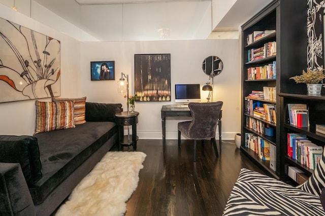 living room with wood finished floors and baseboards