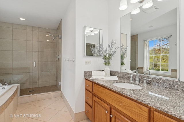 3625 Johns Manville Ave, Gurnee, IL 60031 - bathroom with visible vents, tile patterned flooring, a stall shower, a relaxing tiled tub, and vanity