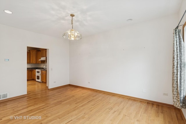 3625 Johns Manville Ave, Gurnee, IL 60031 - interior space with a chandelier, baseboards, visible vents, and light wood-type flooring