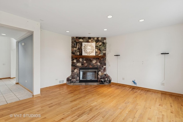 3625 Johns Manville Ave, Gurnee, IL 60031 - unfurnished living room with recessed lighting, visible vents, wood finished floors, and a fireplace
