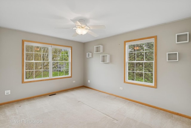 3625 Johns Manville Ave, Gurnee, IL 60031 - unfurnished room with baseboards, ceiling fan, a healthy amount of sunlight, and light colored carpet
