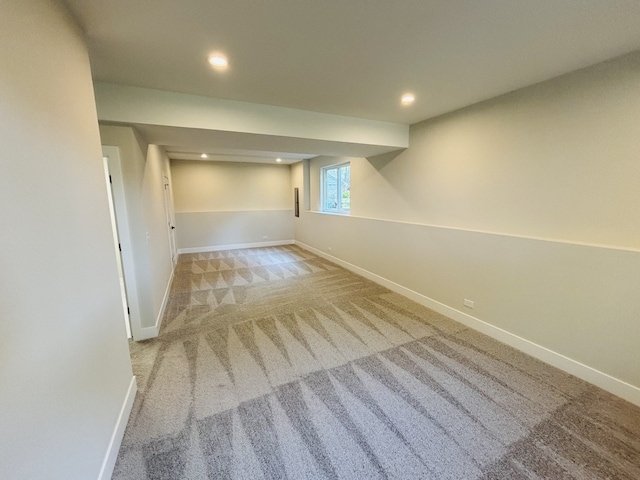 below grade area featuring baseboards, carpet, and recessed lighting