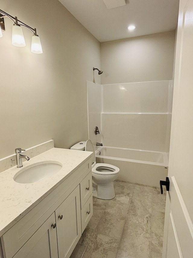 full bathroom with toilet, vanity, and washtub / shower combination