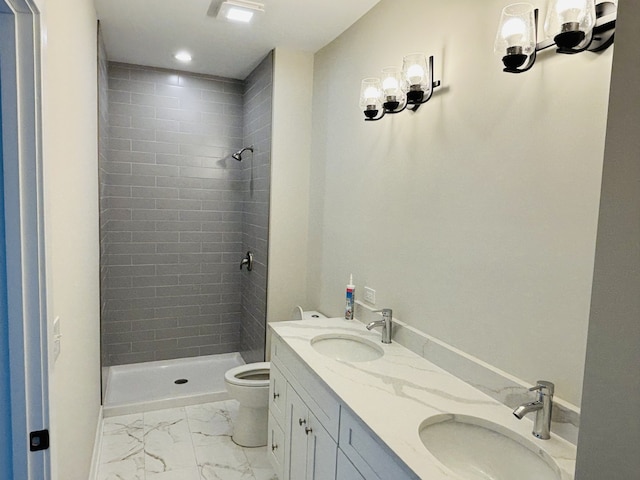 bathroom with marble finish flooring, toilet, a stall shower, double vanity, and recessed lighting