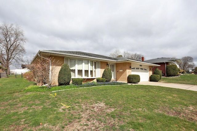 view of front of home featuring a garage, a front yard, brick siding, and concrete driveway