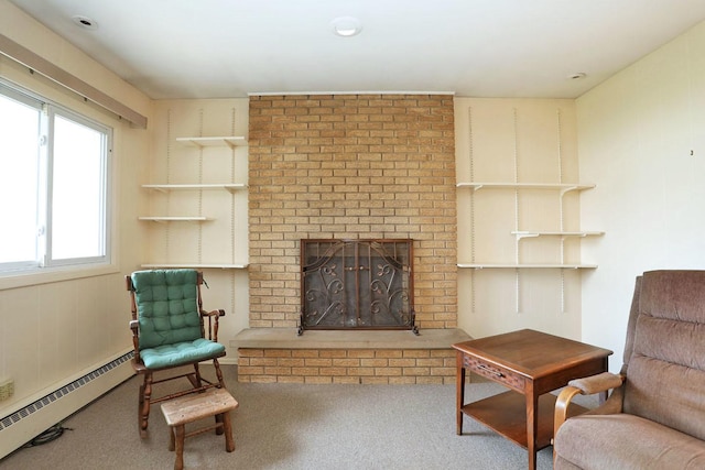 carpeted living room with a baseboard radiator and a fireplace