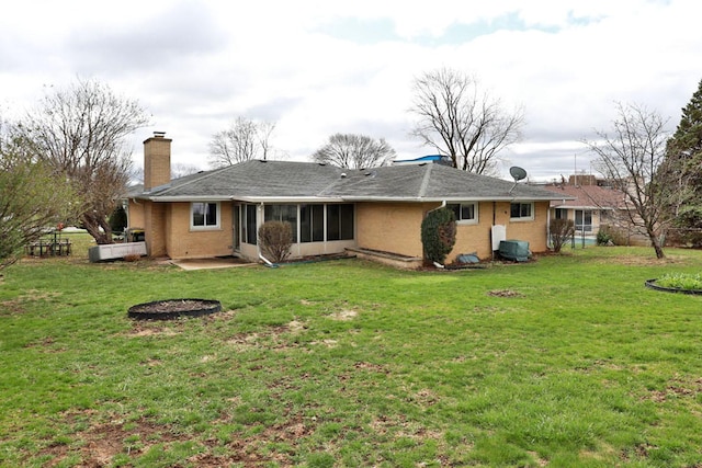 back of house with a sunroom, a yard, fence, and a chimney