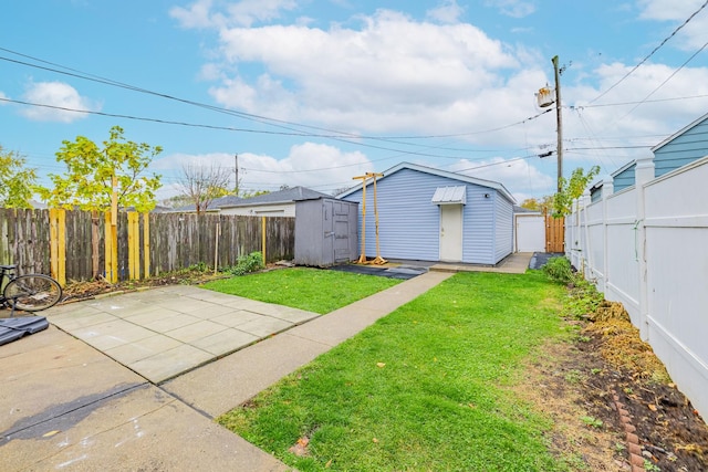 view of yard with a patio, an outdoor structure, a fenced backyard, and a storage shed