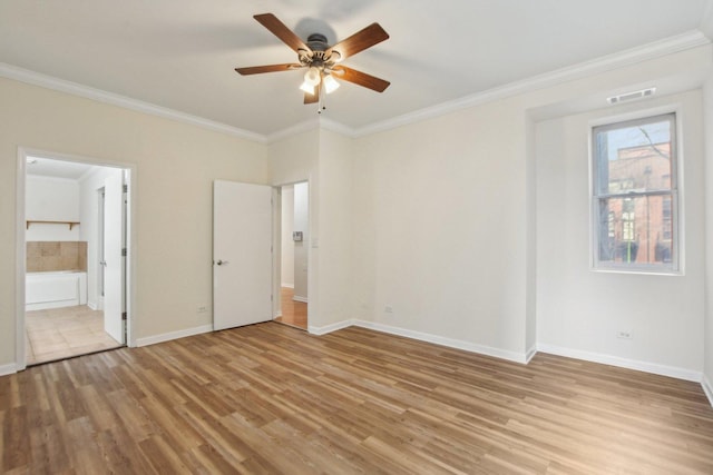 2317 W Wolfram St Unit 211, Chicago, IL 60618 - unfurnished bedroom with ornamental molding, light wood finished floors, baseboards, connected bathroom, and a ceiling fan