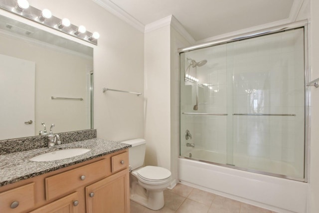 2317 W Wolfram St Unit 211, Chicago, IL 60618 - bathroom with crown molding, vanity, toilet, tile patterned floors, and combined bath / shower with glass door