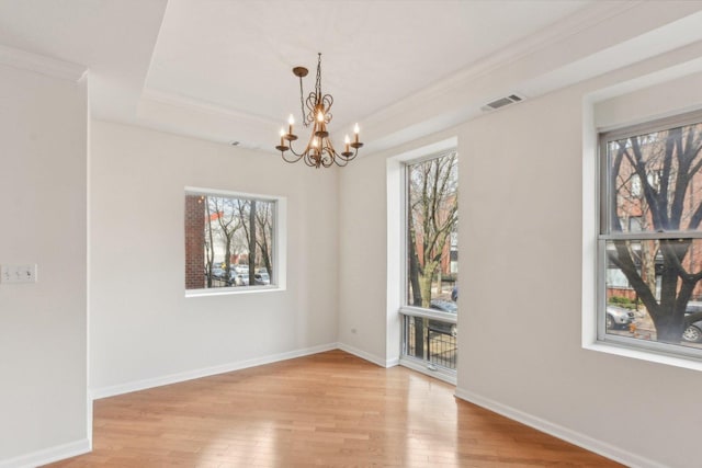 2317 W Wolfram St Unit 211, Chicago, IL 60618 - unfurnished room featuring a chandelier, light wood-style flooring, ornamental molding, and baseboards