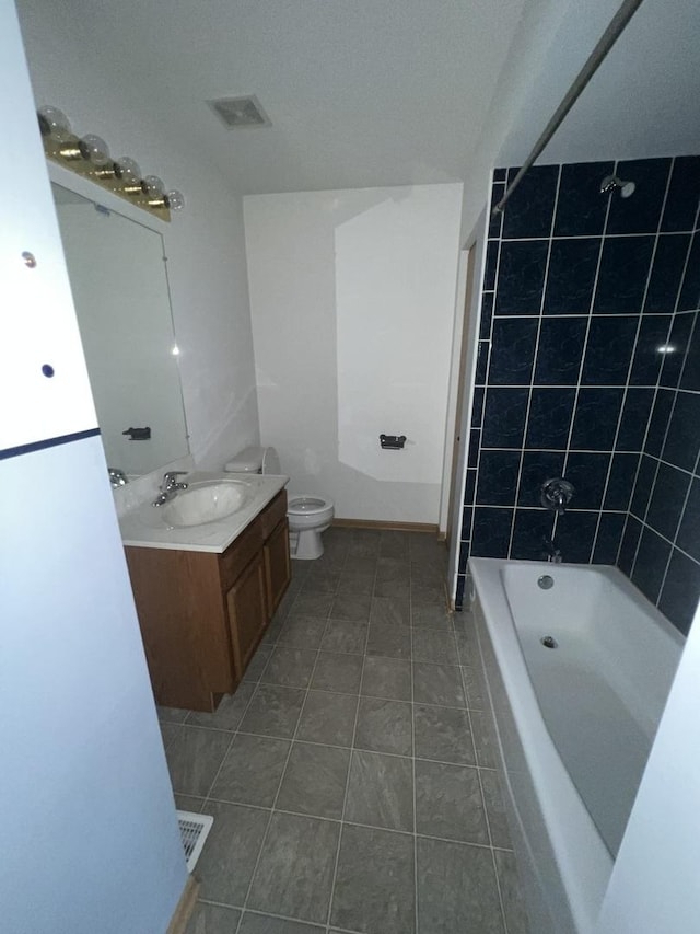 full bathroom featuring visible vents, toilet, vanity, shower / bathtub combination, and tile patterned flooring
