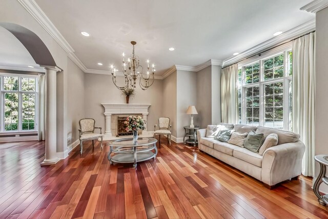 105 Fuller Rd, Hinsdale, IL 60521 - living area with a wealth of natural light, ornate columns, arched walkways, and wood finished floors