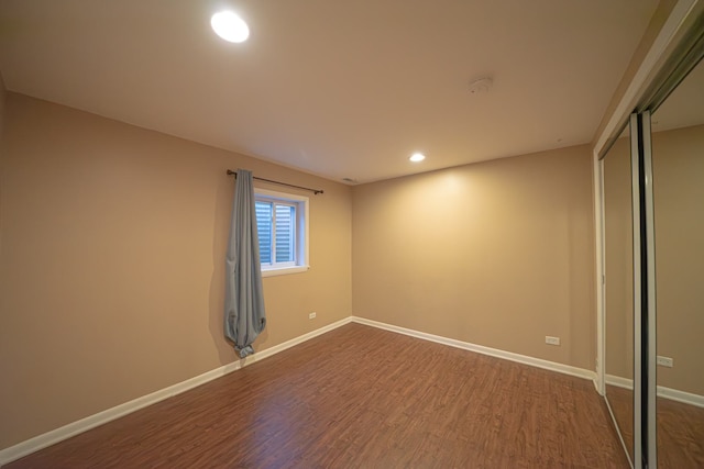 interior space with recessed lighting, baseboards, and dark wood-style floors