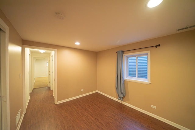 unfurnished room featuring visible vents, baseboards, recessed lighting, and dark wood finished floors